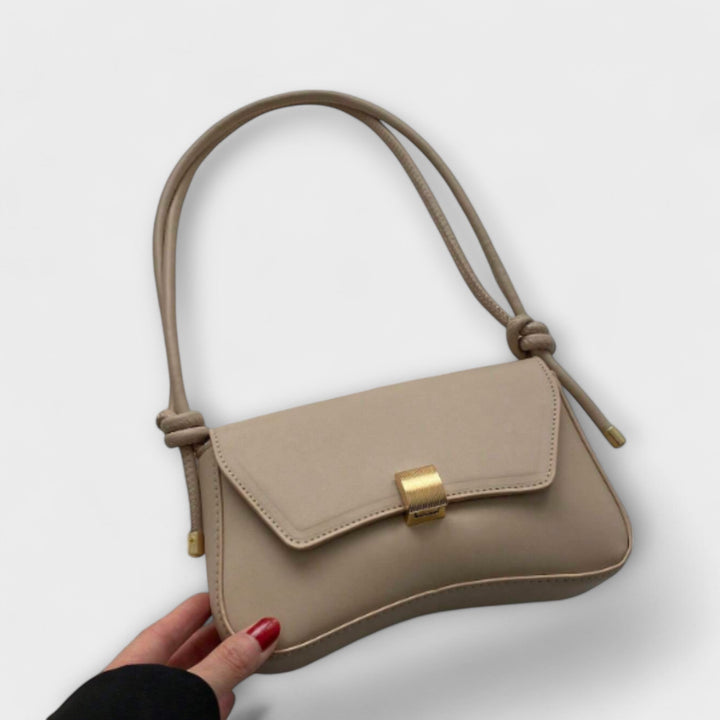 Vintage Leather Handbag with Classic Clasp Closure