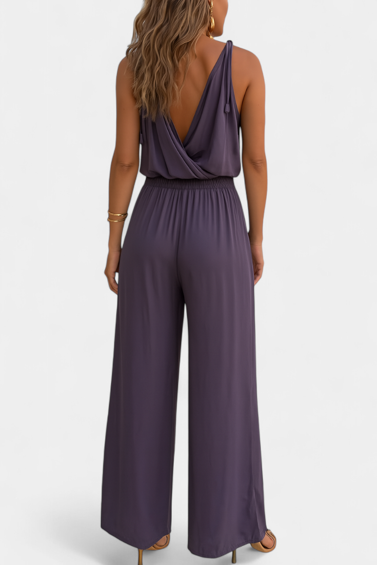 Backless Jumpsuit with Gold Accents and Crossover Neckline