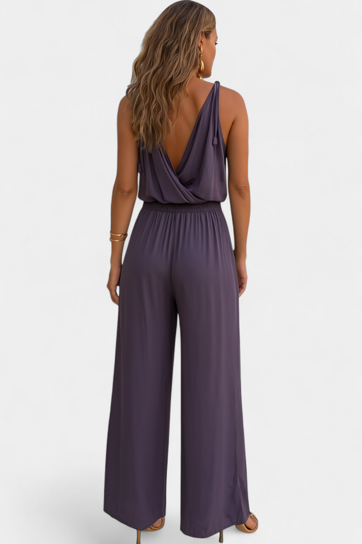 Backless Jumpsuit with Gold Accents and Crossover Neckline